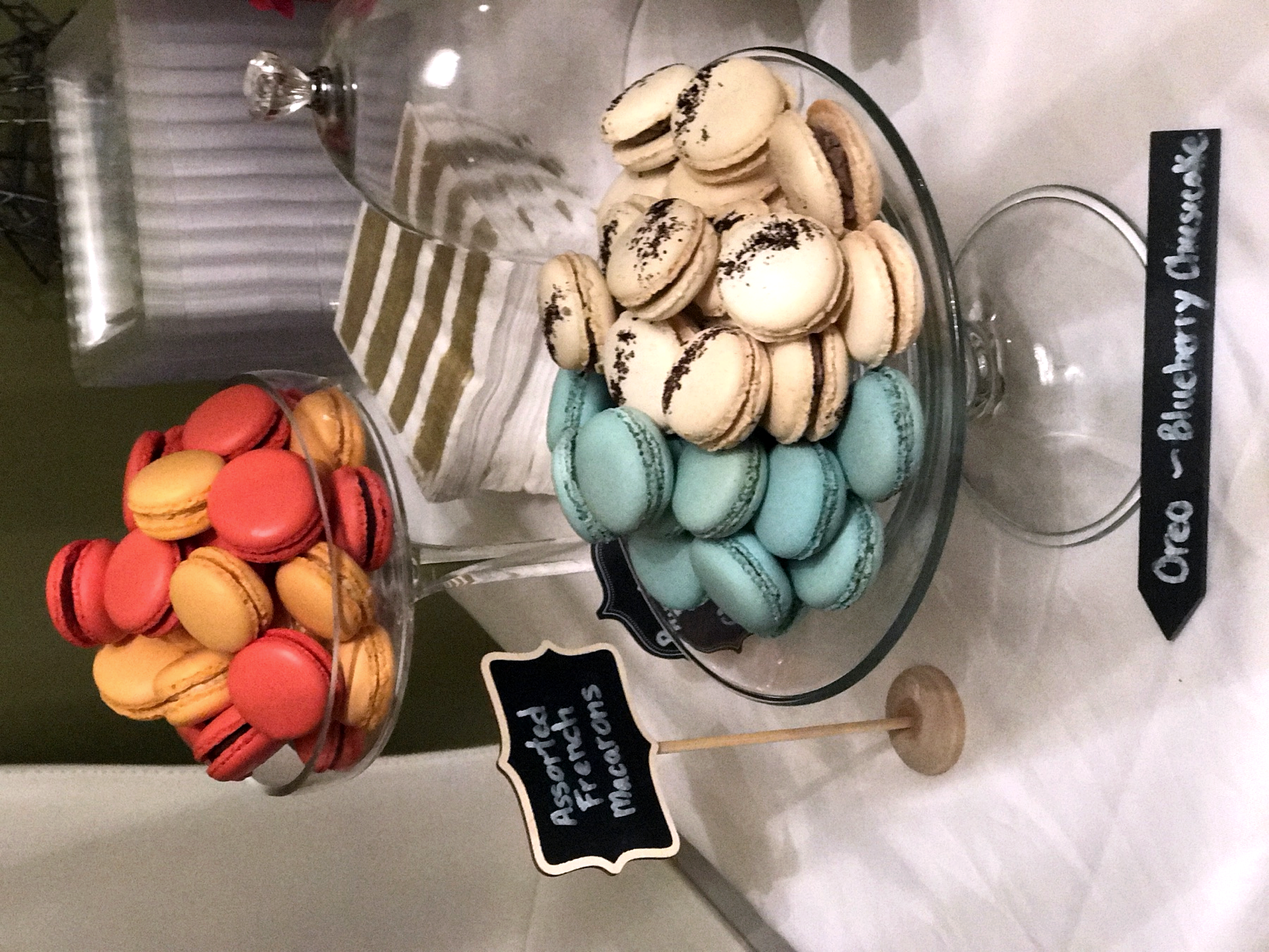 French macarons displayed in glass jars