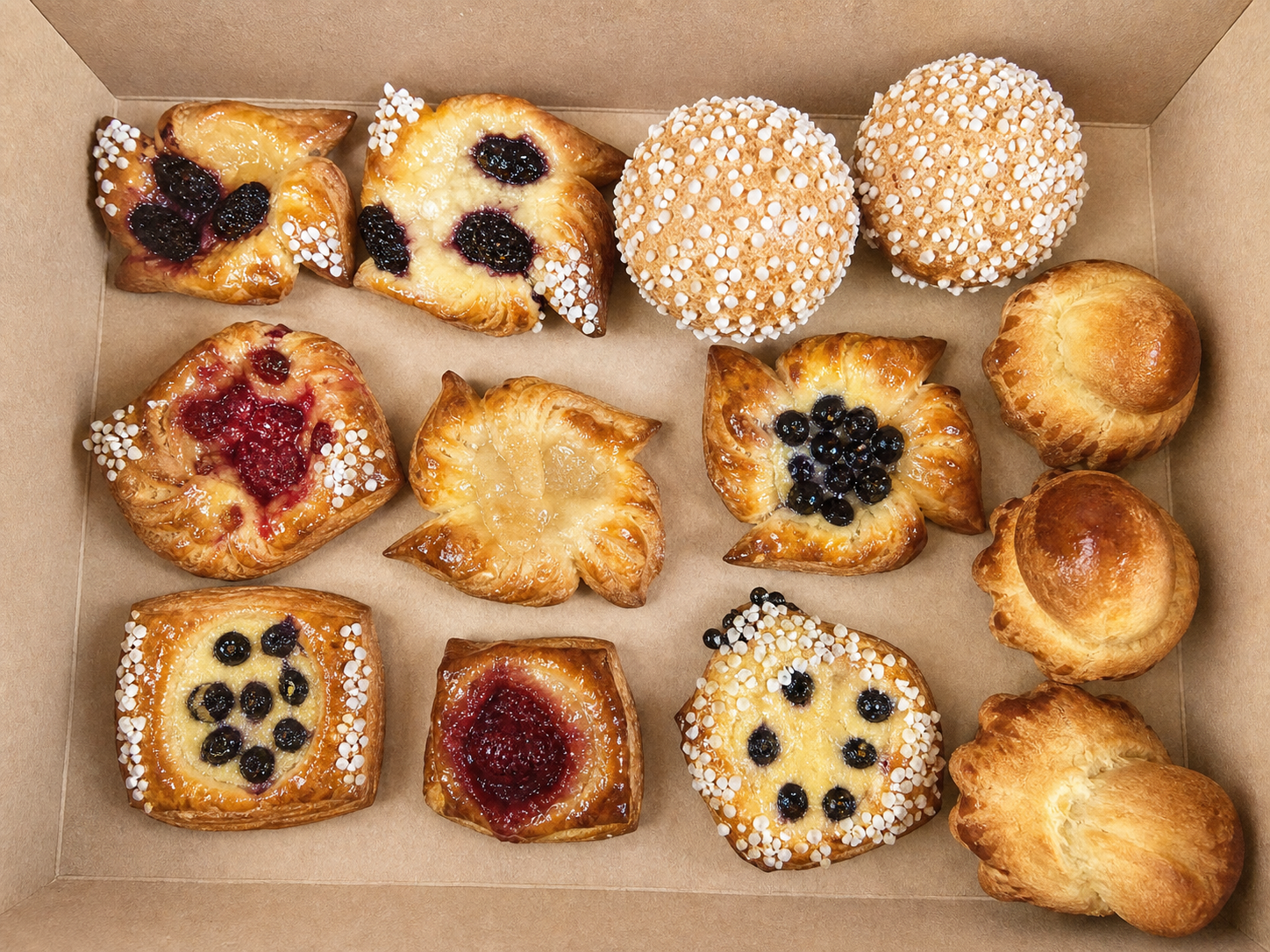 Assorted small fruit pastries in a box